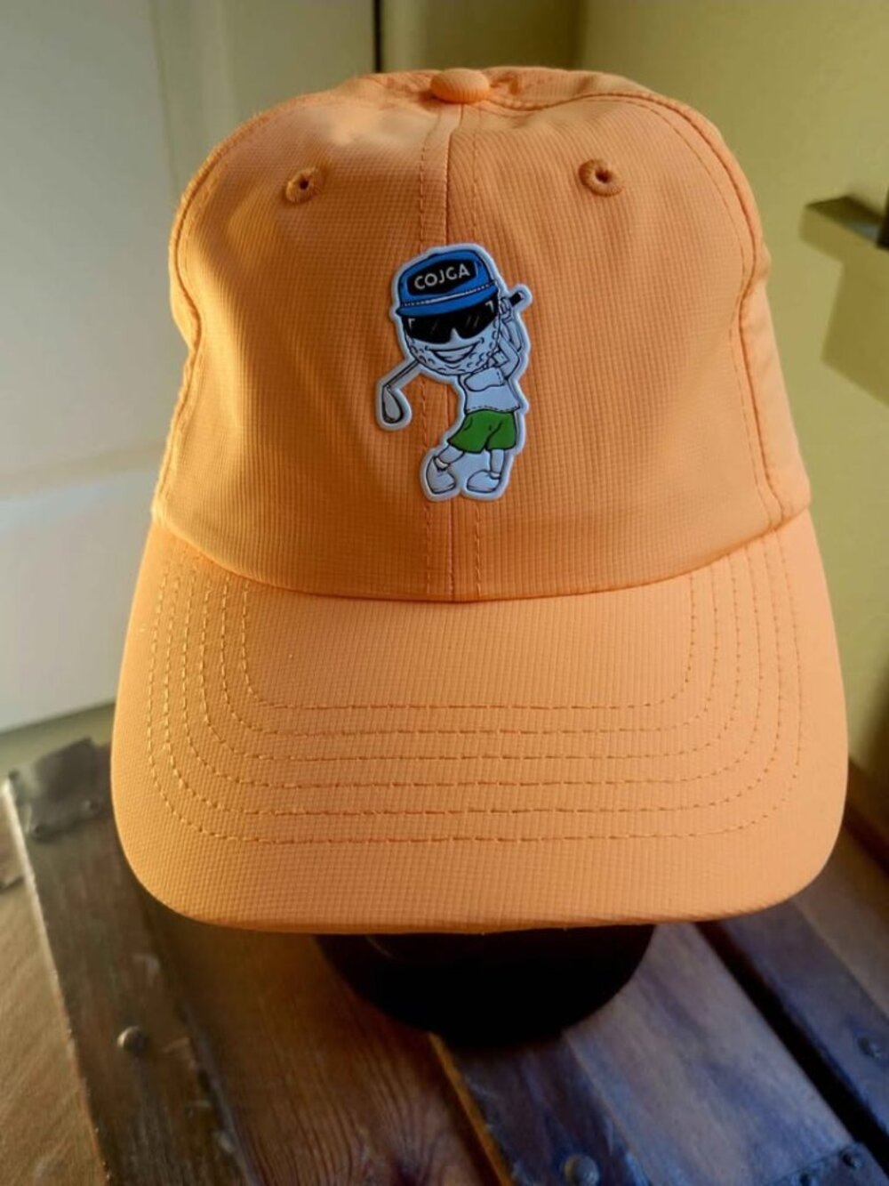 Orange Imperial Performance Baseball Cap With a Cartoon Golfer